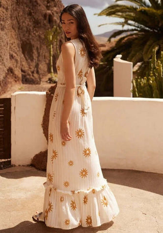 Begonia Dress New Dubai by Sundress, elegant sleeveless beach dress with golden suns and ruffled bottom.