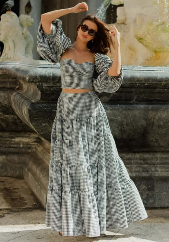 Odette Skirt Black Gingham by Sundress, featuring a stylish tiered design perfect for summer outfits.