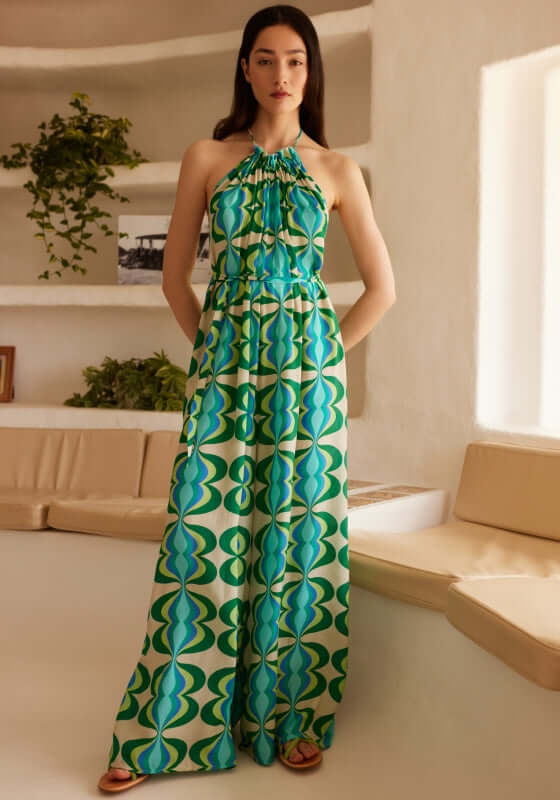Sophie Jumpsuit Lullah by Sundress, a relaxed green retro print jumpsuit with high neck halter tie and wide legs.