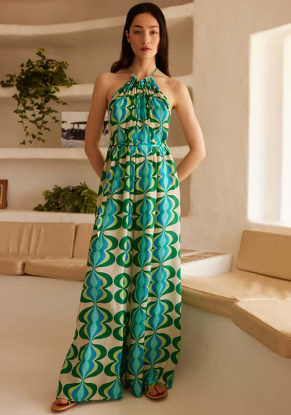 Sophie Jumpsuit Lullah by Sundress, a relaxed green retro print jumpsuit with high neck halter tie and wide legs.