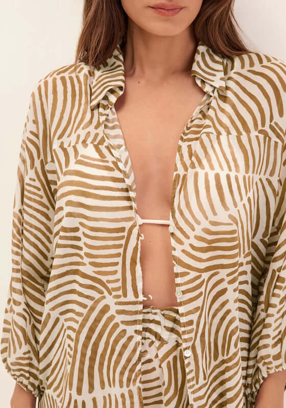 Moana Beach Shirt Nomad by Vix Swimwear displayed on a model, showcasing a lightweight, breathable design with earthy tones.