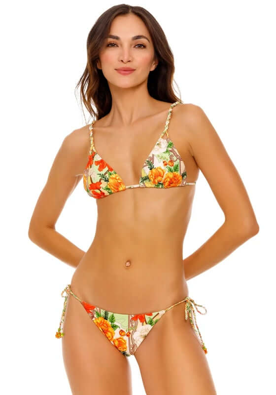 Nury Ete Bikini Top by Agua Bendita, featuring vibrant floral patterns and a stylish triangular design.