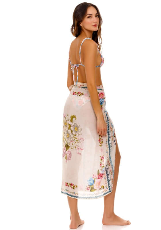 Zinna Pareo Meraki by Agua Bendita, flowy floral cover-up worn elegantly as a skirt.