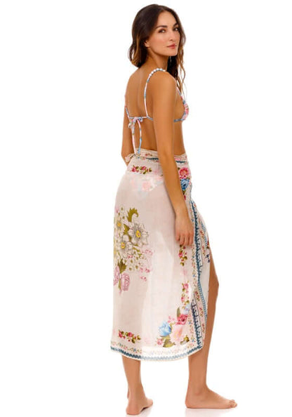 Zinna Pareo Meraki by Agua Bendita, flowy floral cover-up worn elegantly as a skirt.