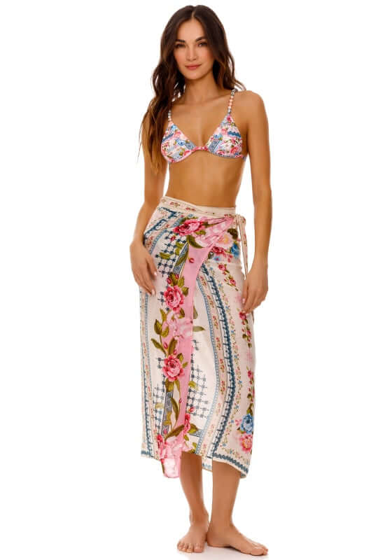Zinna Pareo Meraki by Agua Bendita. Flowy cover-up with floral prints worn as a stylish beach skirt over swimwear.