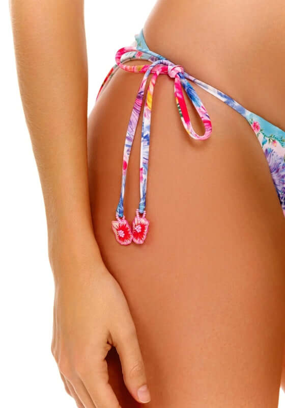 Alegria Chroma Bikini Bottom by Agua Bendita features adjustable floral tie details and vibrant colors for a stylish beach look.