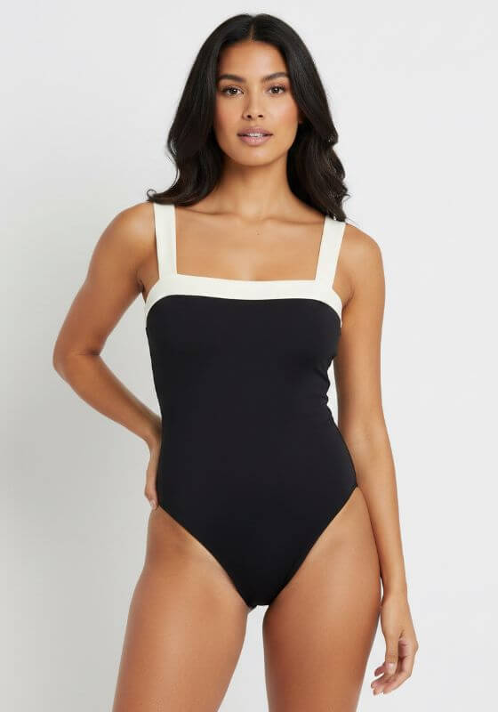 Grenada Swimsuit by Away That Day, black one-piece with squareneck and ivory straps, perfect for beach days.