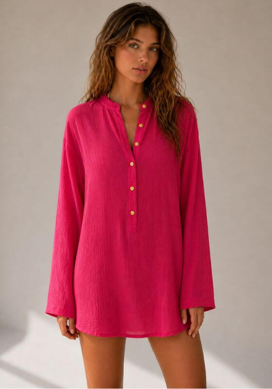 Raspberry La Digue Tunic by Away That Day, a relaxed button-down cover-up in a vibrant pink shade.