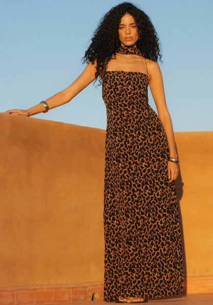 St Tropez Dress Leopard by Away That Day, featuring a model in a leopard print maxi dress with spaghetti straps.
