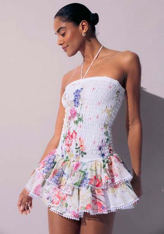 Cusia White Botanical by Charo Ruiz, featuring a flattering smocked bodice and vibrant floral print dress.