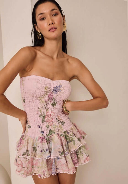 Cusia Short Dress Pink Botanic by Charo Ruiz, featuring a smocked bodice and frilly layered skirt, perfect for summer.