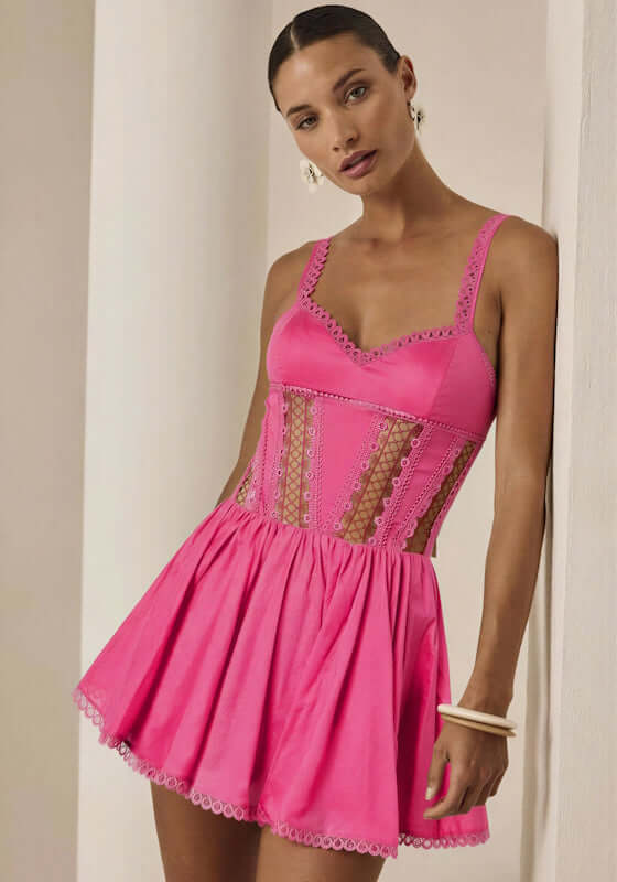 Gardenia Short Dress Fuchsia by Charo Ruiz, featuring a sweetheart neckline, lace panels, and a playful skater skirt.