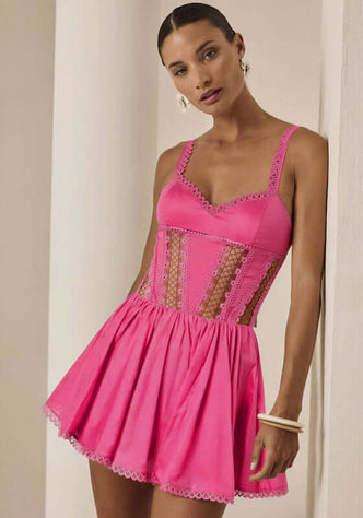 Gardenia Short Dress Fuchsia by Charo Ruiz, featuring a sweetheart neckline, lace panels, and a playful skater skirt.