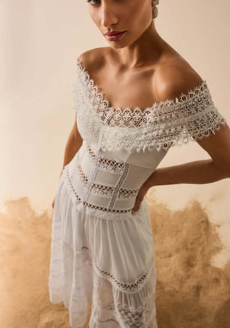 Amaira Dress White by Sole Lisboa, off-shoulder long dress with delicate cutout detailing and structured bodice.