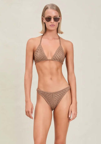 Lucina Bikini Truffle by Devon Windsor model showcases shimmery triangle top and classic hipster bottoms for beach elegance.
