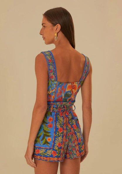 Stiched Garden Blue Romper by Farm Rio, showcasing the back view of a floral-patterned blue romper with a square neckline.