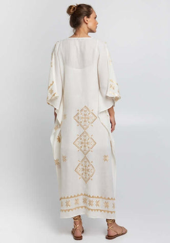 Lefkada Maxi V Neck Kaftan White by Greek Archaic Kori, featuring delicate gold embroidery and a flowing design for elegant summer wear.