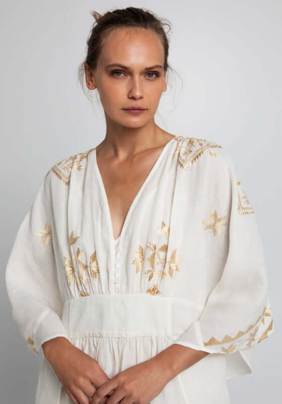 Lefkada Maxi V Neck Kaftan White by Greek Archaic Kori, featuring delicate gold embroidery and a flattering V-neck design.