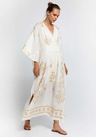 Lefkada Maxi V Neck Kaftan White by Greek Archaic Kori, featuring a V-neck and gold embroidery in flowing white fabric.
