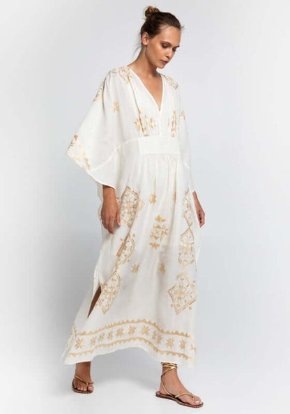 Lefkada Maxi V Neck Kaftan White by Greek Archaic Kori, featuring a V-neck and gold embroidery in flowing white fabric.