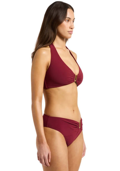 Jetset DD Halter Bikini Burgundy by Jets Swimwear, showcasing a model in a burgundy bikini with removable cups and stylish gold trim.