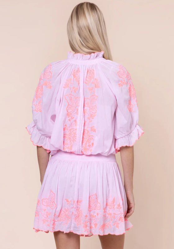 Butterfly Blouson Dress Petal Pink by Juliet Dunn, showcasing back view with pink fabric and vibrant butterfly embroidery.