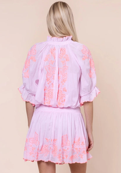 Butterfly Blouson Dress Petal Pink by Juliet Dunn, showcasing back view with pink fabric and vibrant butterfly embroidery.