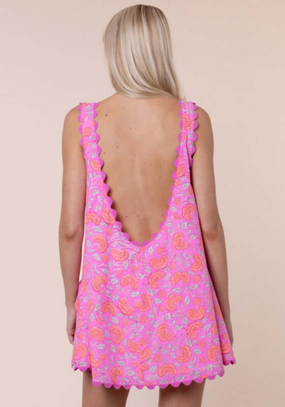 Floral Low Back Dress Fuchsia by Juliet Dunn showcasing a vibrant pink floral print and scalloped hem.