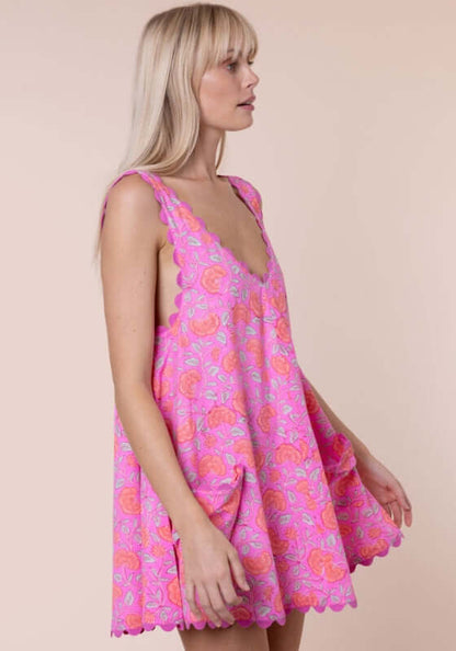 Floral Low Back Dress Fuchsia by Juliet Dunn, showcasing a vibrant pink floral print and scalloped hem in a breezy silhouette.