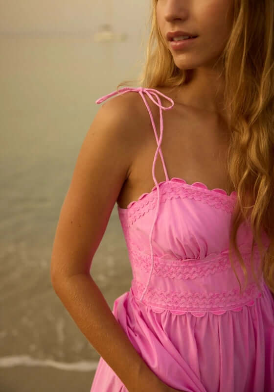 Poplin Hi-Low Dress Hibiscus by Juliet Dunn, featuring a sweetheart neckline and adjustable spaghetti straps in a charming setting.