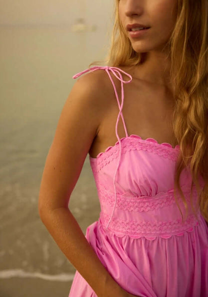 Poplin Hi-Low Dress Hibiscus by Juliet Dunn, featuring a sweetheart neckline and adjustable spaghetti straps in a charming setting.