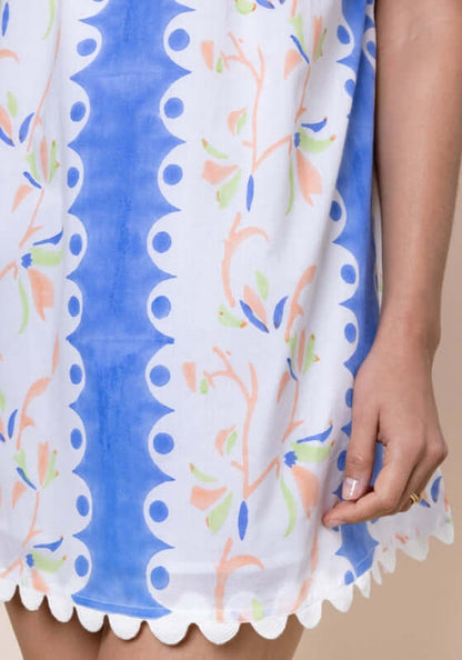 Birds Of Paradise Off Shoulder Dress by Juliet Dunn, showcasing vibrant blue patterns and delicate floral prints with scallop hem.