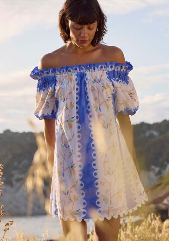 Birds Of Paradise Off Shoulder Dress by Juliet Dunn, featuring vibrant blue patterns and playful puff sleeves.
