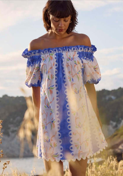 Birds Of Paradise Off Shoulder Dress by Juliet Dunn, featuring vibrant blue patterns and playful puff sleeves.