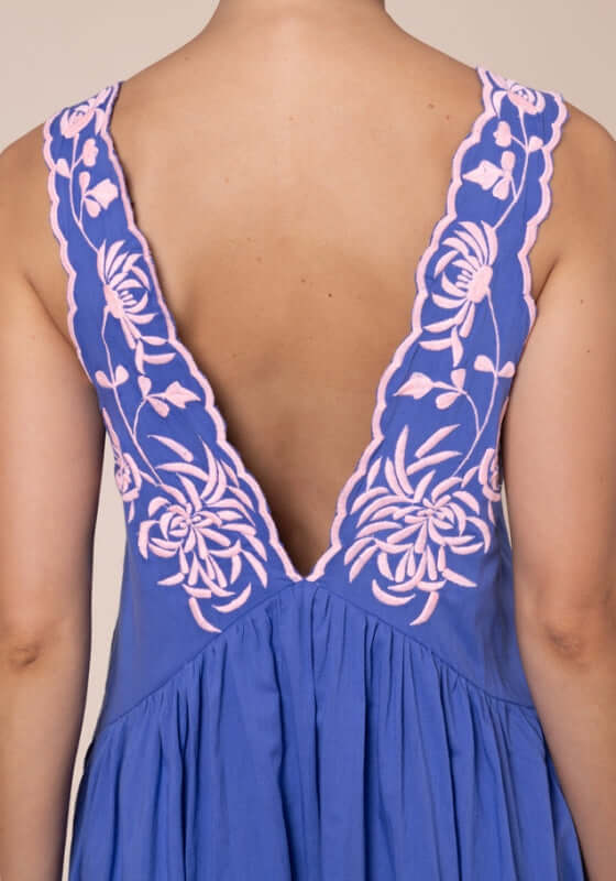Butterfly V Neck Mini Dress Denim by Juliet Dunn, featuring a deep V back with pink floral embroidery detail.