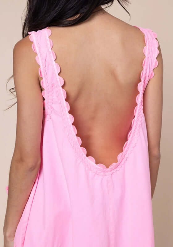 Ric Rac Low Back Dress Flamingo by Juliet Dunn, showcasing a chic low back design and scalloped edges in vibrant pink.