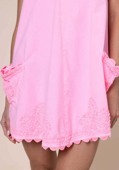 Ric Rac Low Back Dress Flamingo by Juliet Dunn, showing pink dress with playful patch pockets and scalloped hem.