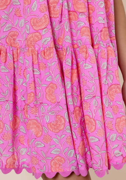 Floral Strappy Mini Dress Fuchsia by Juliet Dunn, showcasing a vibrant floral design in pink with a stylish tiered hem.