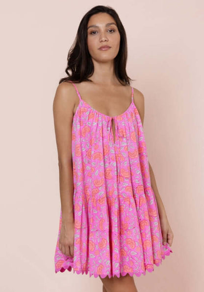 Floral Strappy Mini Dress Fuchsia by Juliet Dunn, model wearing a vibrant pink floral mini dress against a soft background.
