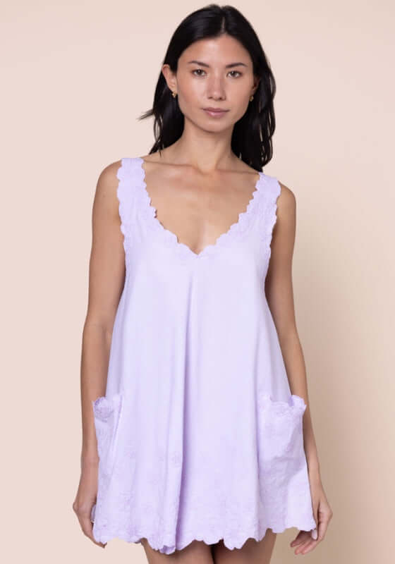 Poplin Floral Low Back Dress Lilac by Juliet Dunn, showcasing a lilac dress with a low back and patch pockets.