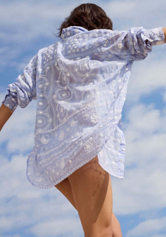 Mexican Embroidered Shirt Hydrangea by Juliet Dunn, showcasing the intricate patterns and lightweight fabric in a sunlit setting.