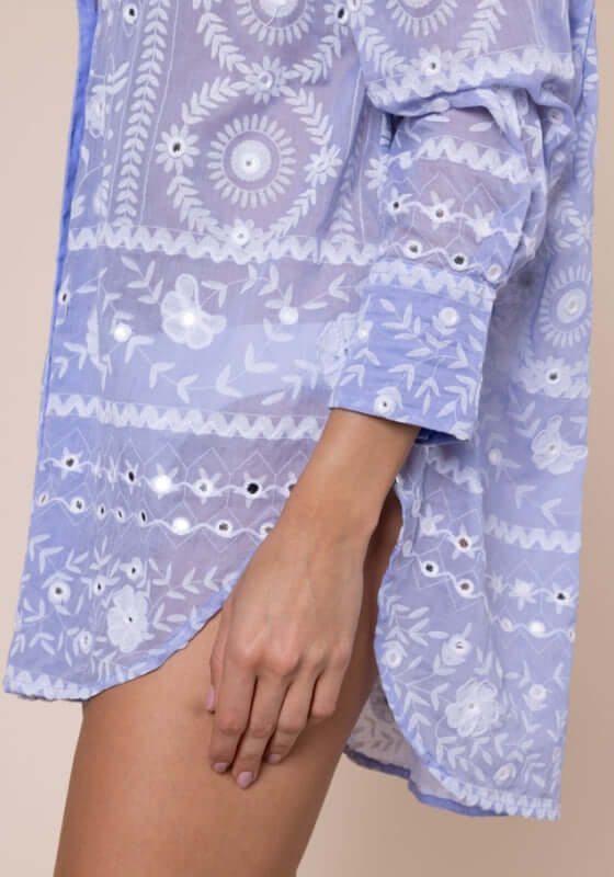 Mexican Embroidered Shirt Hydrangea by Juliet Dunn, showcasing intricate patterns in soft hydrangea blue fabric.