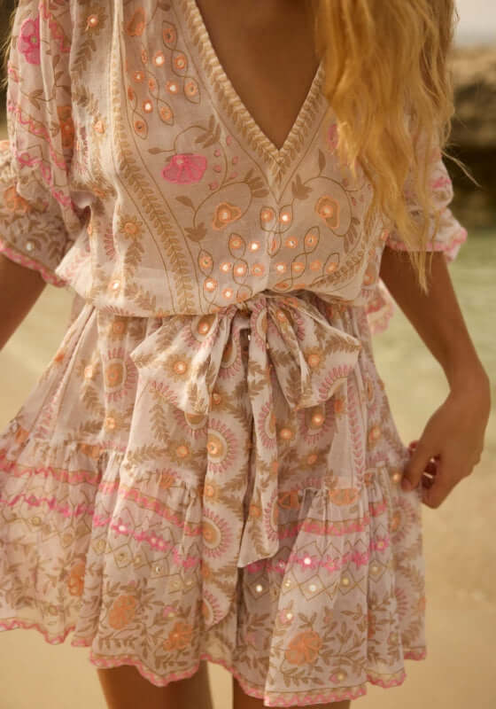 Mexican Embroidered Mini Beach Dress by Juliet Dunn, showcasing delicate pink embroidery and shimmering details.