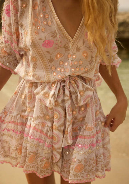 Mexican Embroidered Mini Beach Dress by Juliet Dunn, showcasing delicate pink embroidery and shimmering details.