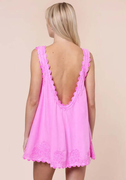 Poplin Low Back Dress Hibiscus by Juliet Dunn, showcasing the back view of a chic pink dress with scalloped edges.