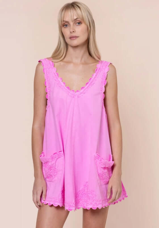 Poplin Low Back Dress Hibiscus by Juliet Dunn, featuring a pink sleeveless design with playful patch pockets.