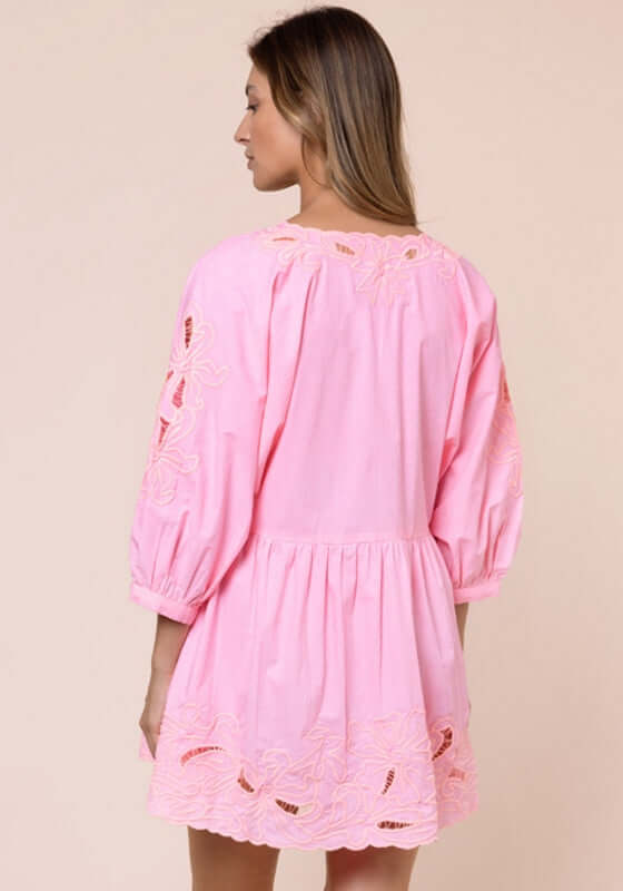 Poplin Tiered Mini Dress Paloma by Juliet Dunn. Back view of a pink dress with scalloped hem and puffy sleeves.