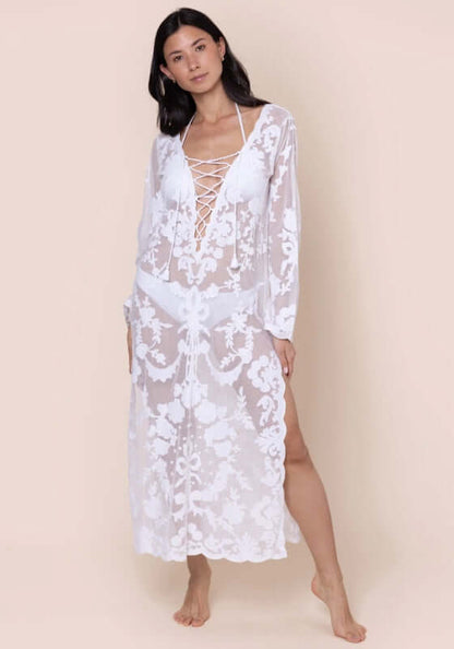 Embroidered Net Lace Up Kaftan by Juliet Dunn, model wearing a white lace-up kaftan with side split and floral embroidery.