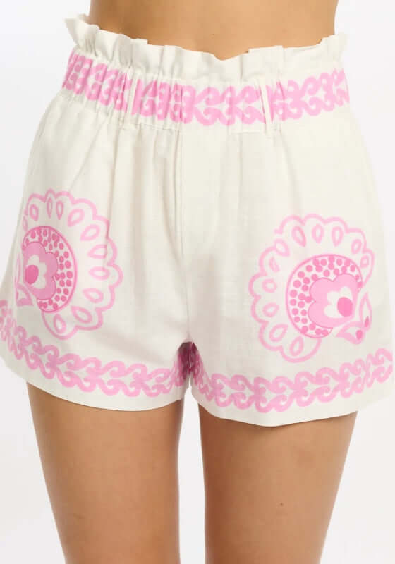 Mady Beach Shorts by Miss June featuring white fabric with pink paisley print and an elasticated waist.