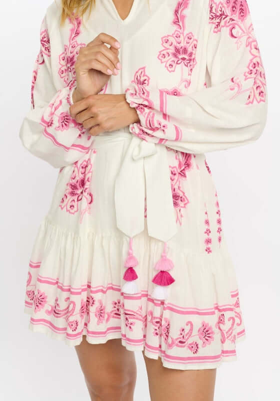 Anika Dress by Miss June, featuring pink paisley print on off-white, V-neckline, tassel belt, and balloon sleeves.